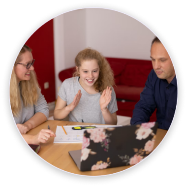 A child and her parents on a laptop